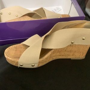 Size 10 tan colored wedge sanders by Steve Madden